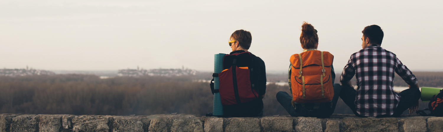 backpackers looking across the horizon